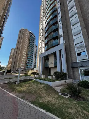a building with two tall buildings in a city at Alquiler Temporario Amoblado in Cordoba