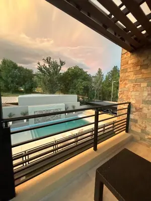 a view from the balcony of a house with a swimming pool at Solana Apart in Mina Clavero