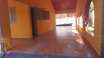 an empty hallway of a house with orange walls at Casa Pileta Exclusiva A 40 Mtrs Rio Y 2 Minutos Del Centro in Villa Carlos Paz