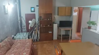 a living room with a couch and a table at Casa Pileta Exclusiva A 40 Mtrs Rio Y 2 Minutos Del Centro in Villa Carlos Paz
