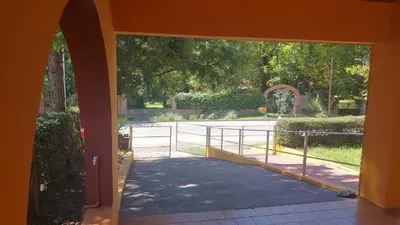 an entrance to a house with a gate and a walkway at Casa Pileta Exclusiva A 40 Mtrs Rio Y 2 Minutos Del Centro in Villa Carlos Paz