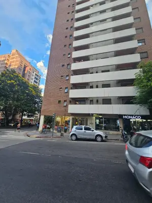 a car parked in front of a tall building at Alto Parana Depto en Nueva Cordoba! in Cordoba
