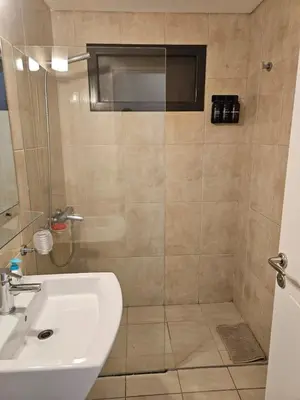 a bathroom with a shower and a sink at Alto Parana Depto en Nueva Cordoba! in Cordoba