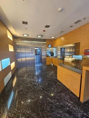 an office lobby with a marble floor and wooden walls at Alto Parana Depto en Nueva Cordoba! in Cordoba