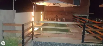 a wooden fence with a light on top of it at Complejo José León in Arroyo de Los Patos