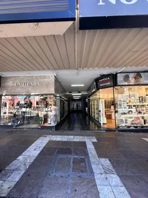 an empty shopping mall with a store in it at Duplex peatonal in Villa Carlos Paz