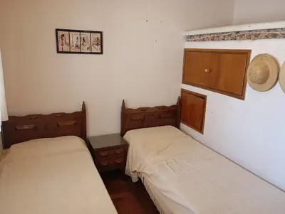 a room with two beds in a room at Casa Ranqueles in Villa Carlos Paz