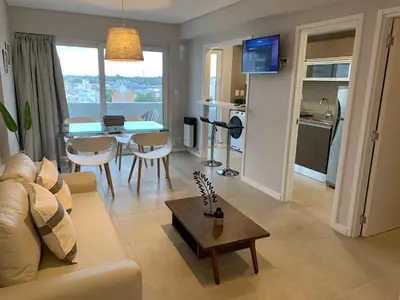 a living room with a couch and a table at Rent a Flat in Cordoba