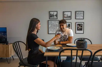a man and a woman sitting at a table at Rent a Flat in Cordoba
