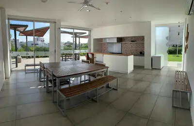 a kitchen and dining room with a table and chairs at Rent a Flat in Cordoba