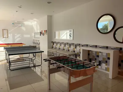 a room with a table and a mirror on the wall at Rent a Flat in Cordoba