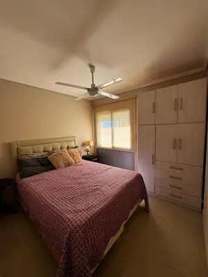 a bedroom with a bed and a ceiling fan at Beautiful apartment in Cordoba