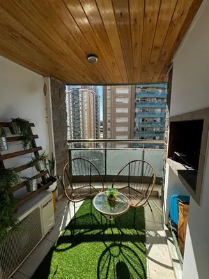 a balcony with two chairs and a table on a balcony at Beautiful apartment in Cordoba