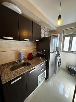 a kitchen with a sink and a refrigerator at Beautiful apartment in Cordoba
