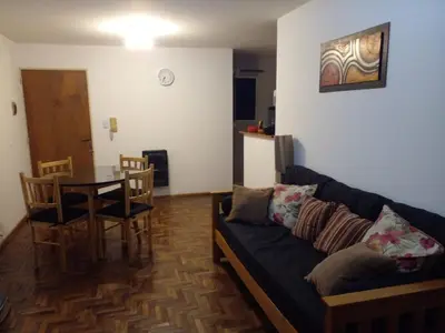 a living room with a couch and a table at Corazón de Nueva Córdoba in Cordoba