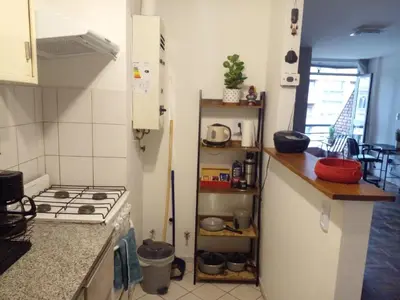 a kitchen with a stove and a counter top at Corazón de Nueva Córdoba in Cordoba