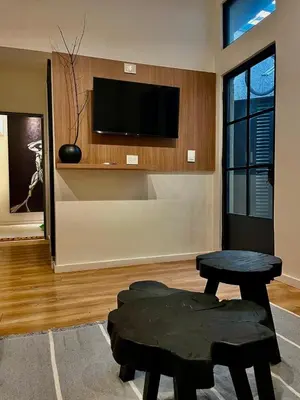 a living room with a table and a tv at Tu Lugar en Cordoba in Cordoba