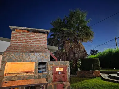 a brick oven in front of a house at Hospedaje Del Rosario in Santa María