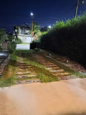 a dirt road with some grass and some bushes at Hospedaje Del Rosario in Santa María