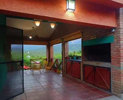 a patio with a view of a table and chairs at El Mirador de Ana Villa de las Rosas in Villa de Las Rosas