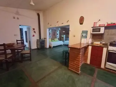 a room with a kitchen and a living room at El Mirador de Ana Villa de las Rosas in Villa de Las Rosas