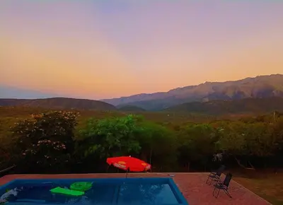 a hot tub with a view of a mountain at El Mirador de Ana Villa de las Rosas in Villa de Las Rosas