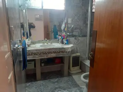 a bathroom with a sink and a mirror at lo de carla in Villa Carlos Paz