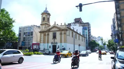 a group of people riding motorcycles down a city street at El Sol de Vilaró Dpto a mts de todo in Cordoba