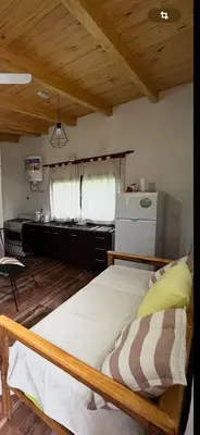a bedroom with a large bed in a kitchen at Cabaña tranquila y gran parque ideal para parejas in Villa Anizacate
