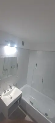 a white bathroom with a sink and a shower at Santino in Cordoba
