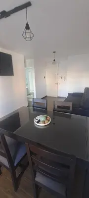 a table with a plate on it in a living room at Santino in Cordoba