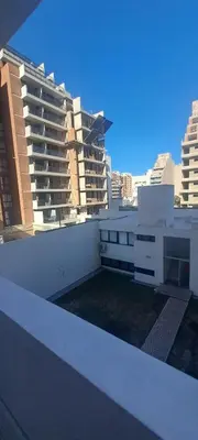 a view from the roof of a building with tall buildings at Santino in Cordoba