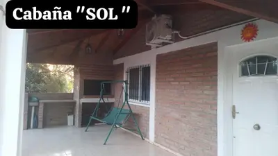 a ladder on a porch next to a brick wall at Sol y Luna in Barrio Parque El Corcovado
