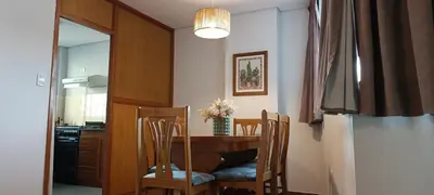 a dining room with a table and two chairs at Depto 2 Dormitorios en centro de Córdoba, amplio y luminoso in Cordoba