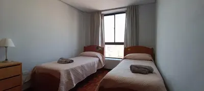 two beds in a room with a window at Depto 2 Dormitorios en centro de Córdoba, amplio y luminoso in Cordoba