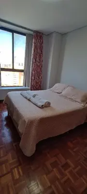 a bedroom with a bed with two towels on it at Depto 2 Dormitorios en centro de Córdoba, amplio y luminoso in Cordoba