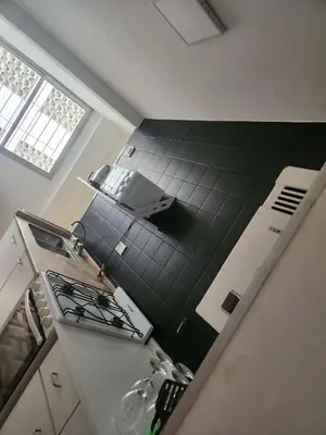 an overhead view of a kitchen with a stove top oven at Departamento con Estilo centro Cordoba - Cañada y Av Colon in Cordoba