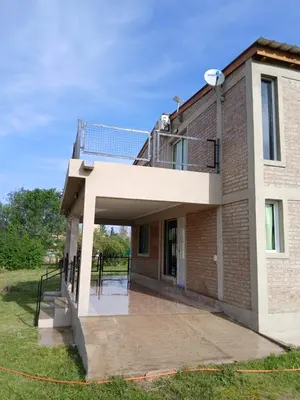 a brick building with a patio and a balcony at Remanso in La Estancia