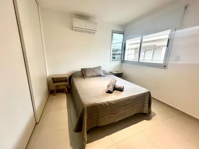 a bedroom with a bed with two pillows on it at Departamento Alberdi para 4 personas in Cordoba