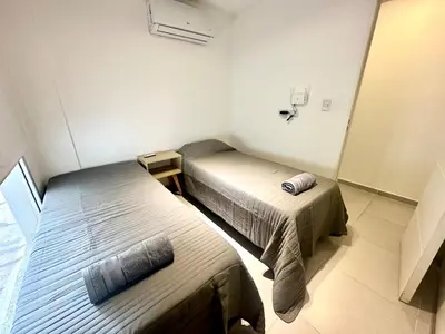 a room with two beds in a room at Departamento Alberdi para 4 personas in Cordoba