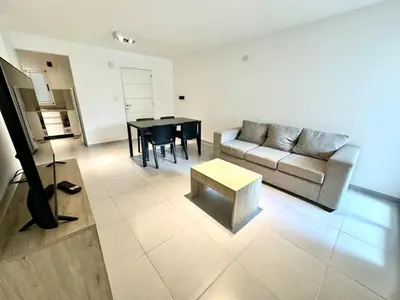 a living room with a couch and a table at Departamento Alberdi para 4 personas in Cordoba