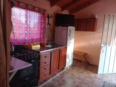 a kitchen with a stove and a refrigerator at Elsieland in Tanti