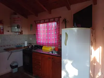 a kitchen with a white refrigerator and a sink at Elsieland in Tanti