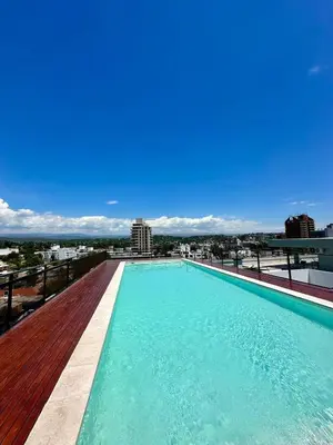 a swimming pool on the roof of a building at Depa de Calidad en el Centro, Piscina in Villa Carlos Paz