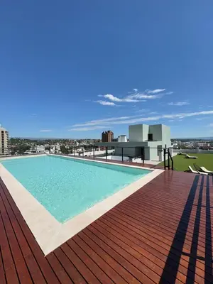 a swimming pool on the roof of a building at Depa de Calidad en el Centro, Piscina in Villa Carlos Paz