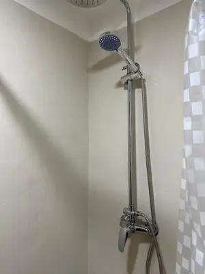 a shower with a shower head in a bathroom at Apartamento Betania in Cordoba