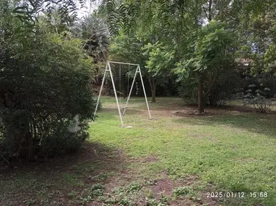 a swing set in the middle of a yard at Los Cachilos in Merlo