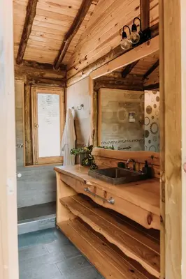a kitchen with a sink and a mirror at La Bernardita in Villa Berna