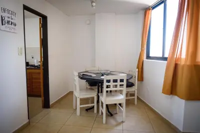 a small dining room with a table and chairs at Depto centro 2 dorm con cochera in Cordoba