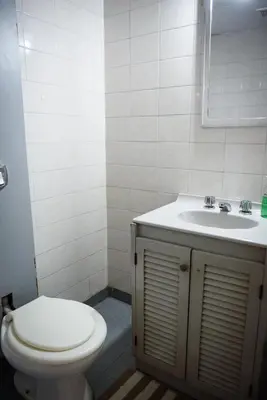 a bathroom with a toilet and a sink at Depto centro 2 dorm con cochera in Cordoba